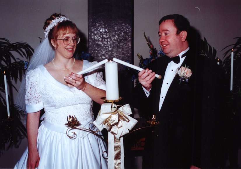 The Bride and Groom Light the Unity Candle