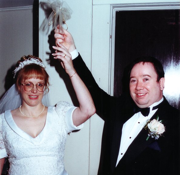 The Bride and Groom strike the church bell
