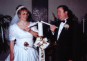 The Bride and Groom light the Unity Candle