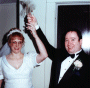 The Bride and Groom strike the church bell